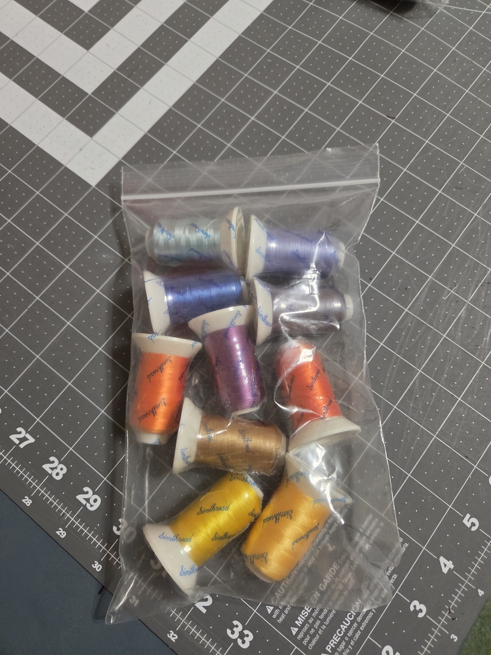 Brother Embroidery Thread Spools in Blue, Purple, Orange, Yellow, Gold